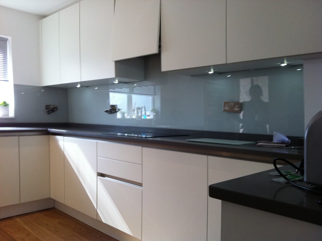 Grey glass kitchen splashback with LED lighting in Highbury