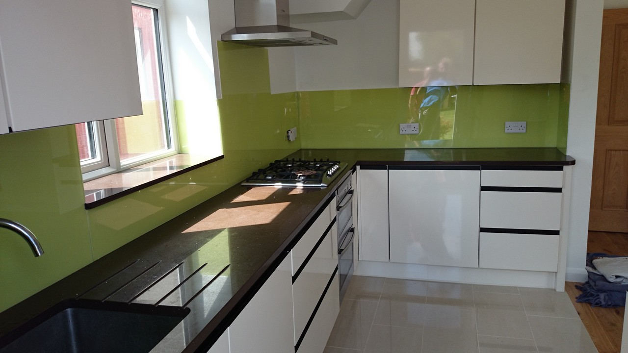 Lime green glass kitchen splashback installed by Highbury glaziers