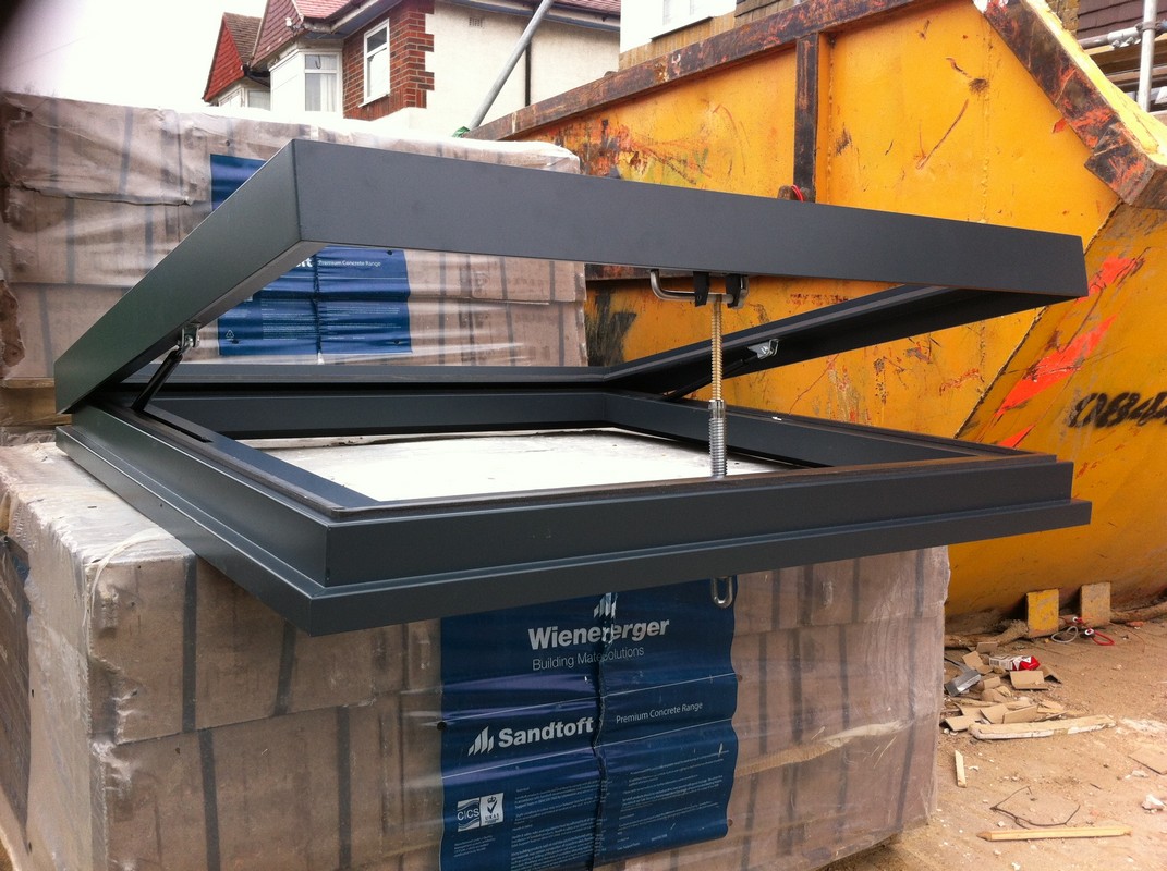 Opening flat roof skylight in anthracite grey installed in Highbury